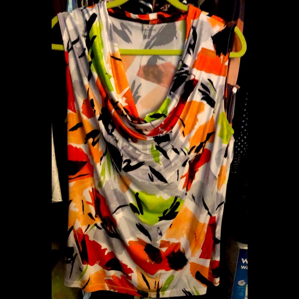Size Large Very cute blouse with multiple colors.